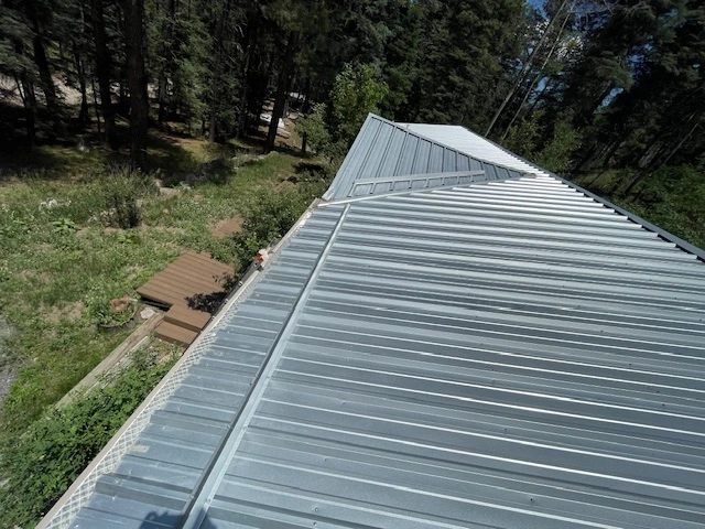 A close-up view of a metal roof showcasing a durable metal roofing system designed for longevity and protection.